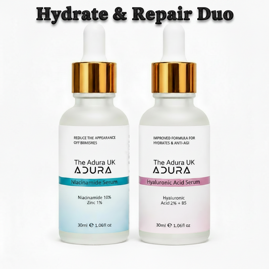 Two 30ml dropper bottles of The Adura skincare serums, shown side-by-side on a white background. The left bottle is labeled 'Niacinamide Serum' with a blue accent band, and the right bottle is labeled 'Hyaluronic Acid Serum' with a pink accent band.
